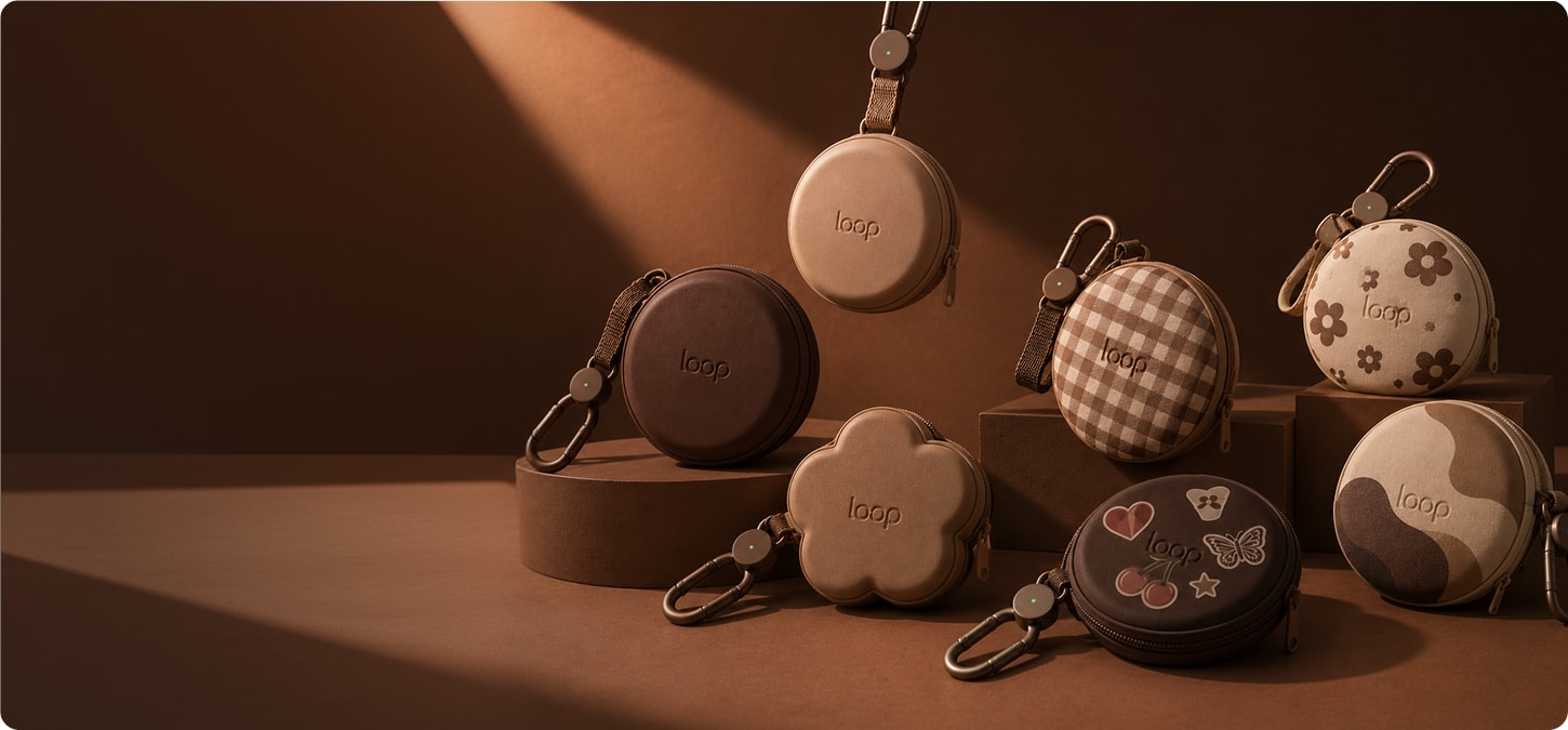 Several personalised Loop cases shown with different patterns and charms.