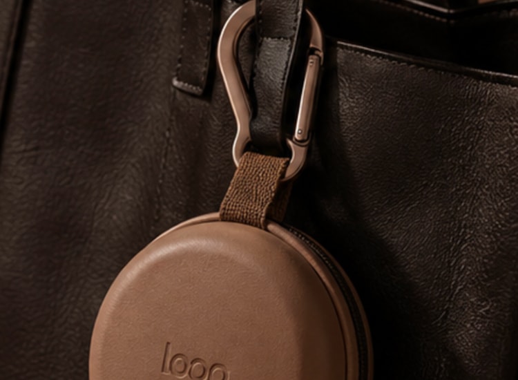 Collapsed Loop cup clipped to the outside of a bag.