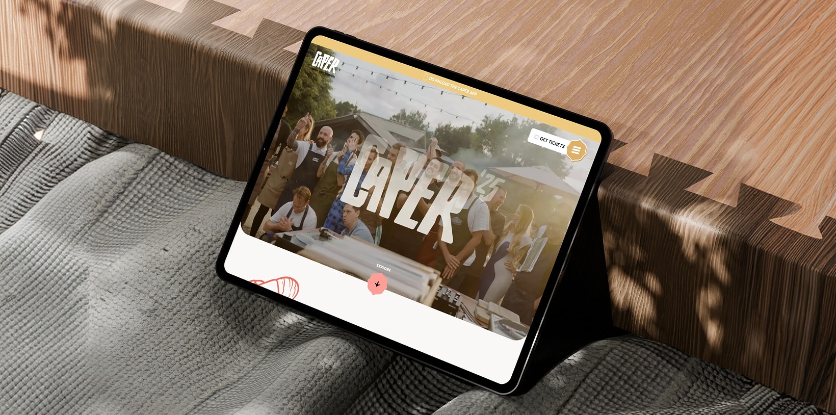 Caper festival website displayed on a tablet.